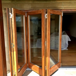 Folding sliding doors in solid Oak by James Riggall Fine Joinery of Exeter, Devon