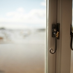 Curly tailed stainless steel handles on hardwood windows by James Riggall Fine Joinery, Exeter